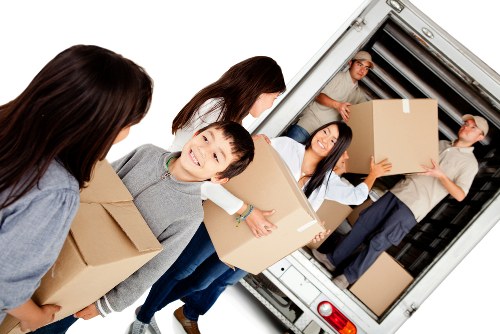 Furniture pick-up service removing a sofa in Barnes