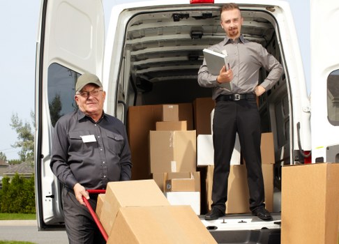 Careful furniture moving in a Barnes property with stairs