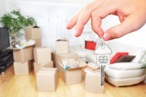 Removal team preparing a home move in Barnes with boxes and furniture