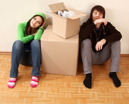 Packed boxes and furniture ready for removal in Barnes