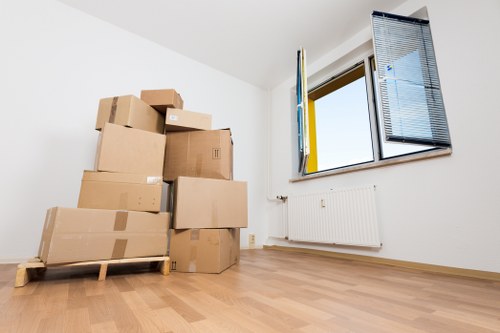 Careful boxing and wrapping of household items for transport in Barnes
