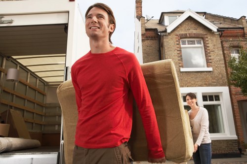 Staff using safe lifting techniques during a move