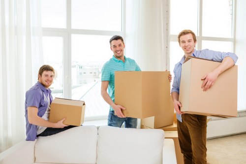 Careful loading of household items into a removal van